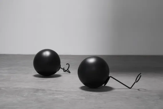 Instruction / for use. The object is hollow and its upthrust force can carry and keep a human being fixed under water. The frame is attached to the neck and the object, floating in water, will carry the human being below, dead or alive.  Porcelain, stainless steel, lacquer, Ø38 cm. Foto: GRAYSC