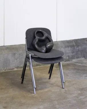 Line Lyhne, Between the back and the belly, 2022, basalt stone, office chairs. Foto: Brian Kure.